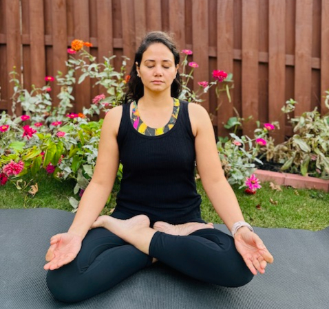 Woman in seated forward bend pose