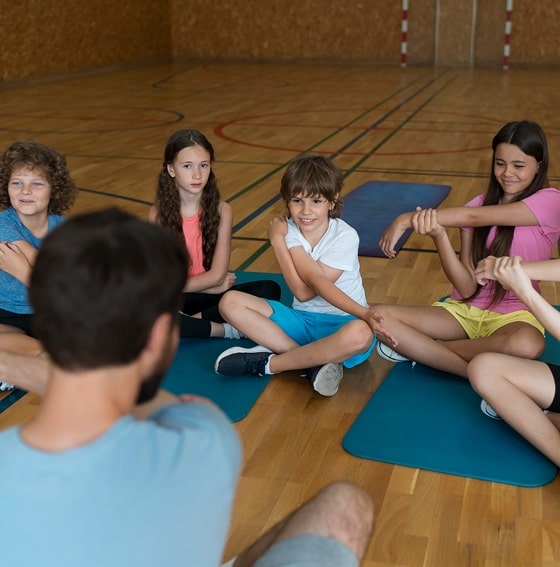 Woman seated on yoga mat
