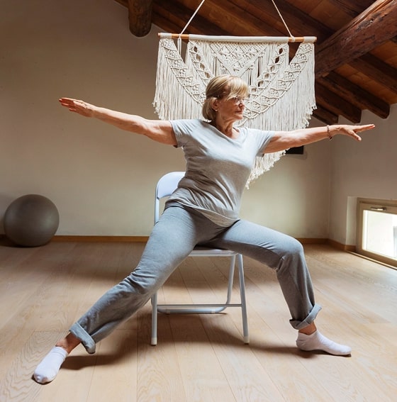Woman seated on yoga mat