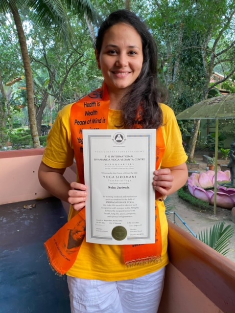 Woman seated on yoga mat