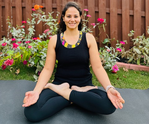 Woman in seated forward bend pose