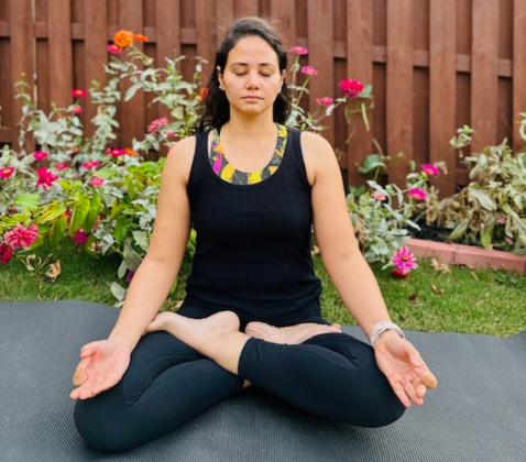 Woman in seated forward bend pose