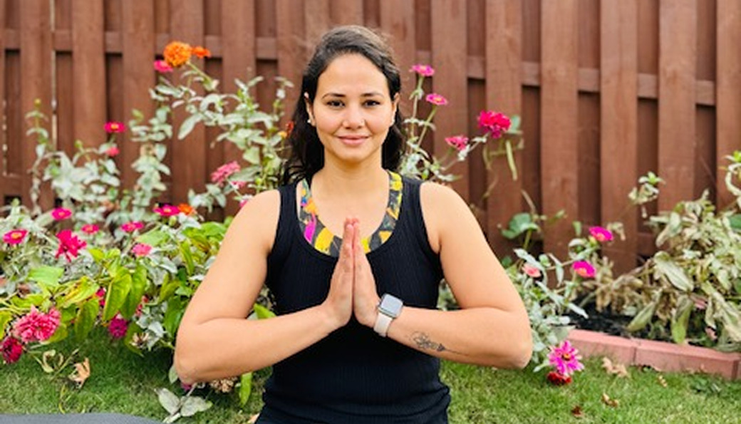 Woman in seated forward bend pose